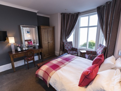 Deluxe Sea View room with kingsize pocket sprung bed and stunning panoramic sea views from armchair bay window