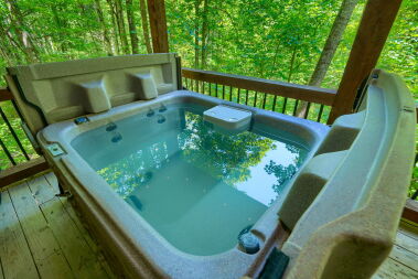 Private outdoor hot tub on covered deck