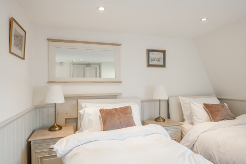 Bedroom 2 on the top floor: 1 Super King or 2 singles beds. Each bed has pocket sprung mattresses which are dressed in Egyptian cotton linen.