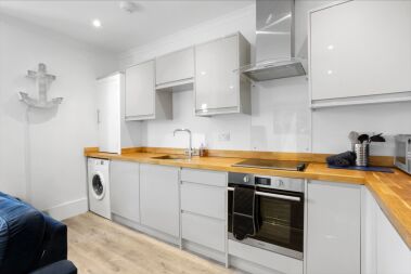 Fully equipped kitchen with oven, fridge freezer, dishwasher and washing machine