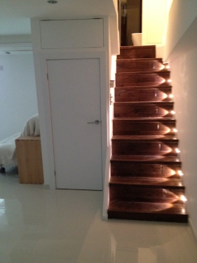 Steps down to the studio with censor lights on steps