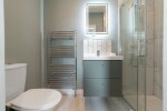 Clean fresh modern bathroom, with walk in shower. toiletries and towels provided