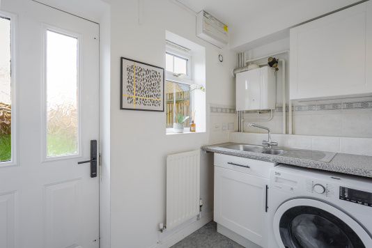 A thoughtfully designed space that keeps daily living effortless and organised. Equipped for laundry and storage, the utility room ensures essentials are neatly tucked away, preserving the home’s calm, uncluttered feel. Functional, refined and perfectly hidden — luxury in the details.