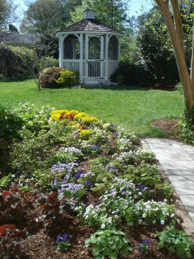 Back flower garden with gazebo