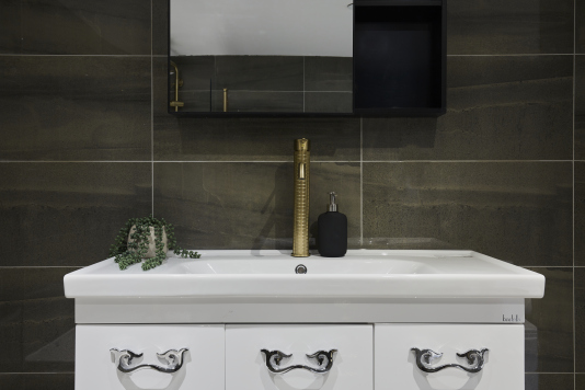 A fresh, well-maintained bathroom with essential amenities provided.