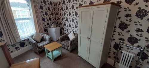 Large Super King Ensuite with Comfy Chairs & Fridge