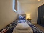 A quiet corner for one, within a house that sleeps many. This single bedroom comes with a 40" Smart TV, en-suite shower, and kettle with tea and coffee, so you can enjoy solo moments between group activities.