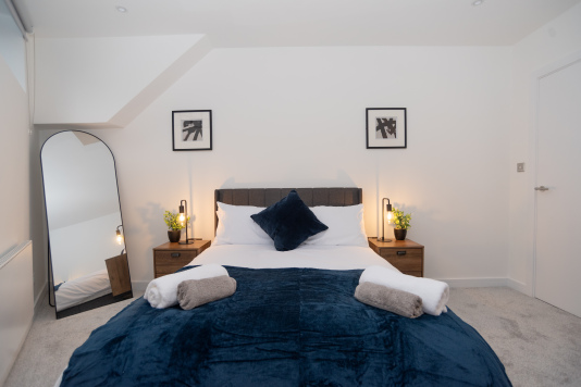 A beautifully decorated second double bedroom with brand-new interiors, super-comfy beds and mattresses, hotel-quality linen, and built-in wardrobes - the perfect Birmingham city centre base for colleagues, friends or family stays.