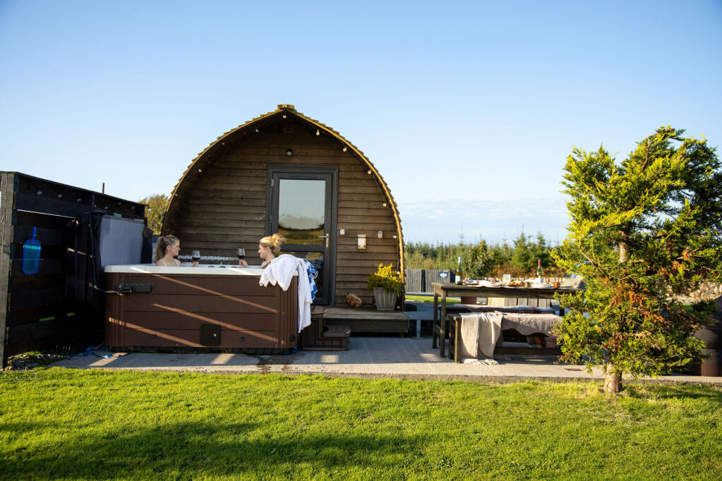 [{'Text': 'Hot tub and outdoor dining area', 'CultureCode': 'en-GB'}] glamping cabins and grounds, photo 32 of 32