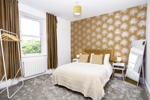 Modern Double Bedroom - Thoughtfully designed with mirror, bedside tables, clothing rail, hangers and hairdryer, perfect for guests or contractors