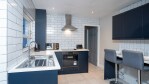 A Bright Modern Fitted Kitchen. You will find all you need for those intimate meals you decide to stay in fand cook. 