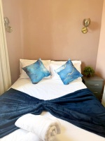 This photo represents the bedroom of the flat