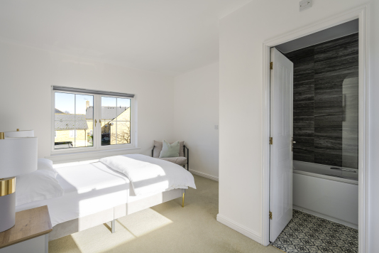 Sink into a luxurious double bed dressed in premium linens, framed by soft lighting and calming tones. This serene sanctuary offers a hotel-quality sleep experience and a peaceful escape from the day.