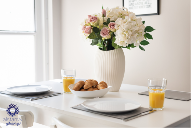 Dining table by French doors into garden