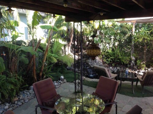 Enjoy your Continental breakfast or coffee in the back yard, under the Lanai, or set  by the koi pond in the cool of the day