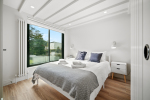 2nd floor loft bedroom with ensuite shower room and king size bed. Views onto private garden.  Blackout blinds. 
