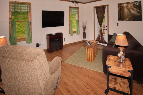 Kick back in the recliner or snuggle on the sofa and enjoy the electric fireplace while watching a movie on Direct TV or bring along your favorite DVD. The sofa sleeper accommodates up to two adults and all linens are provided.