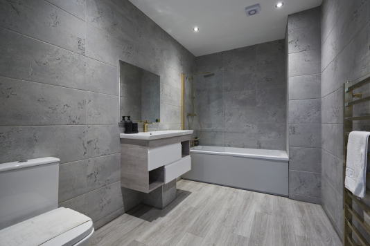 A fresh, well-maintained bathroom with essential amenities provided