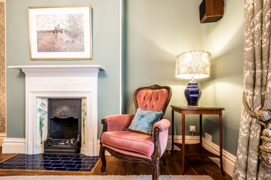 Bedroom 1 by the fireplace