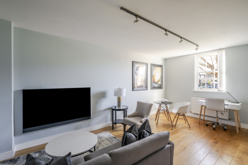 Experience refined comfort in this beautifully designed living room, where sophisticated décor meets effortless elegance. Flooded with natural light, the space features plush seating, stylish accents, and a statement centrepiece that elevates every moment. Perfect for relaxing or entertaining, this room delivers luxury living at its finest.