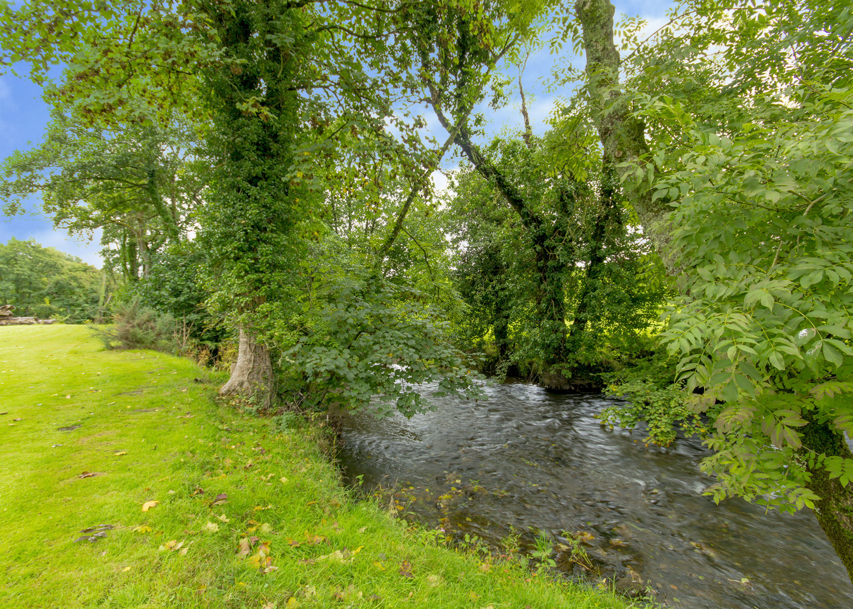 The Cammarch River runs around the gardens