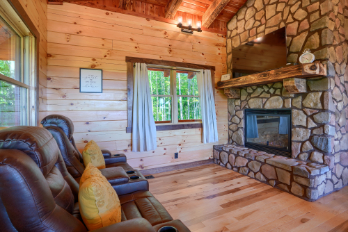 Recliner Couch, Gas Fireplace, and DirecTv screen 1, Soaring Eagle Luxury Treehouse