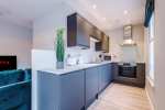 Spacious living room with comfortable seating and inviting atmosphere, perfect for relaxing or socialising during your stay.