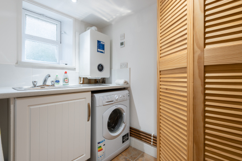 Utility room with washer dryer