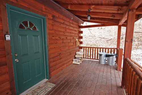 Main Entrance on porch. Firewood not provided.