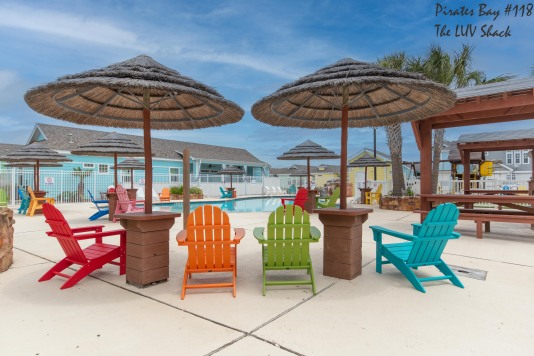 Pirates Bay has colorful adirondack chairs as well has plentiful chaise loungers and regular chairs 