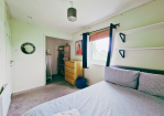 Bedroom 2: Double bed and ample storage