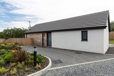 Outside of cottage and parking