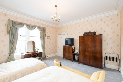 Spacious Bedroom 6 with TV & Ensuite