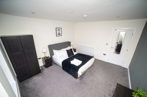 A warm and inviting double bedroom designed with your comfort in mind.