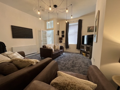 Spacious yet cosy living room with smart TV