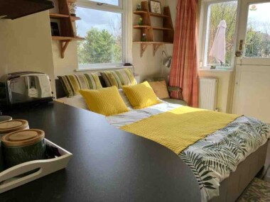 Pleasant south facing double bedroom with fridge, & basic facilities