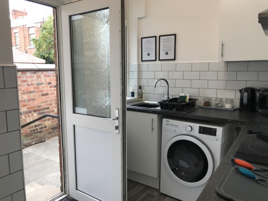 Kitchen leads out to private patio area