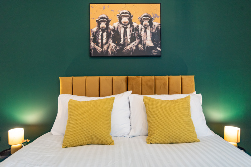 Stylish king bedroom with premium linens and a zip-and-link bed that can be arranged as two singles for flexible sleeping.