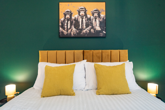 Stylish king bedroom with premium linens and a zip-and-link bed that can be arranged as two singles for flexible sleeping.