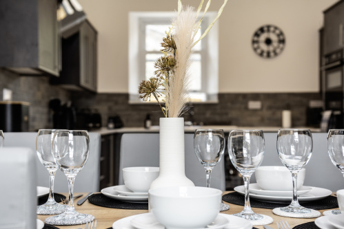 Dressed Dining Table - Fully set with plates, cutlery and wine glasses. Everything you need for the perfect dinner or home-cooked meal. Private chef options available on request