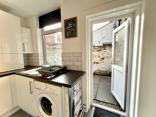 Fully equipped washing area, offering convenience and efficiency for everyday chores.