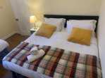 Spacious east facing bedroom with super king bed upstairs