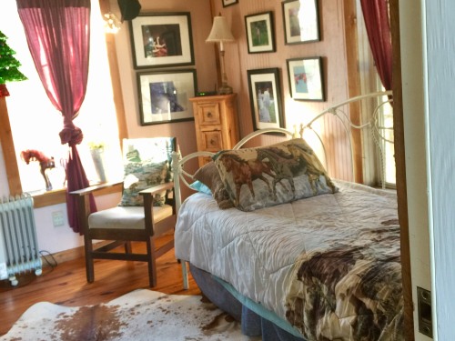 Michelle's Log cabin has 2 single beds downstairs and a queen in the loft.
