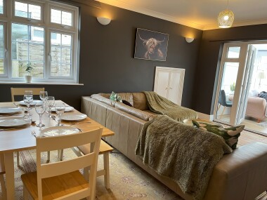 Lounge/Diner with table to sit 6 people, and large comfortable sofa