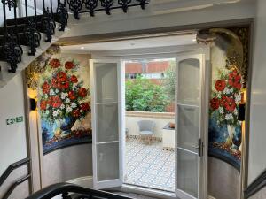 Picture represents the décor and door before entering the  communal balcony