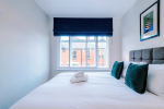 Comfortable bedroom with a king-size zip and link bed that can be separated into two singles upon request.