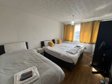 Bedroom 1, with 3 singles or 1 king bed and a single bed