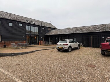 Entrance with patio and parking