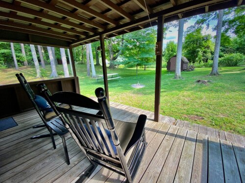 A great back porch that backs to the state park (we can show you the trail heads on arrival).  You also have a fire pit, horseshoe pit, picnic table and 5 Adirondack chairs at the fire pit waiting.  