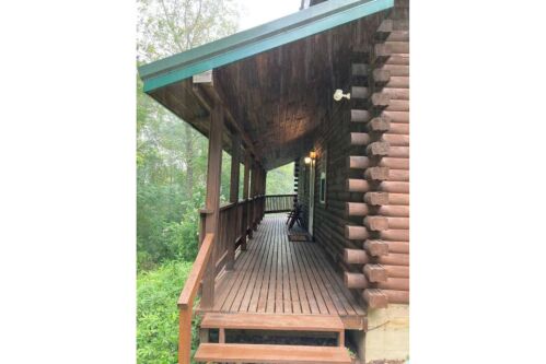 Covered porch to the wraparound deck